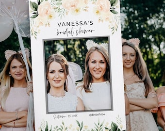 May include: A photo booth prop for a bridal shower, featuring the text "VANESSA'S bridal shower" in elegant script. The frame is decorated with watercolor floral elements and includes the date "September 23, 2023" and the Instagram handle "@BrideTribe".