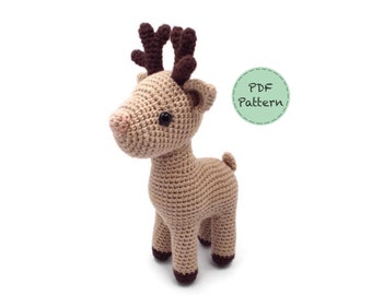 May include: Crochet pattern for a brown and white reindeer with brown antlers. The pattern is available as a PDF download.