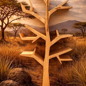 May include: A wooden tree-shaped shelf unit with multiple shelves. The unit is made of light-colored wood and is designed to be mounted on a wall. The background features a landscape with trees and mountains, creating a natural aesthetic.