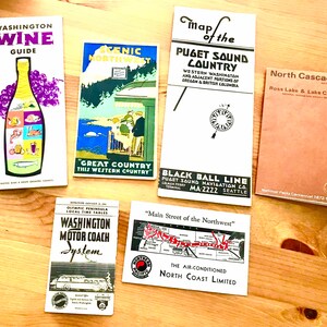 May include: A collection of vintage travel brochures featuring scenic destinations in the Pacific Northwest. The brochures include images of the Puget Sound, North Cascades, and the Olympic Peninsula. The brochures also feature text about the region's history, attractions, and transportation.