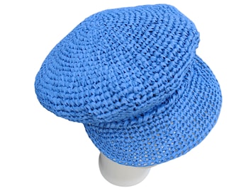 May include: A light blue crocheted hat with a wide brim. The hat is made of a woven material and has a textured surface.