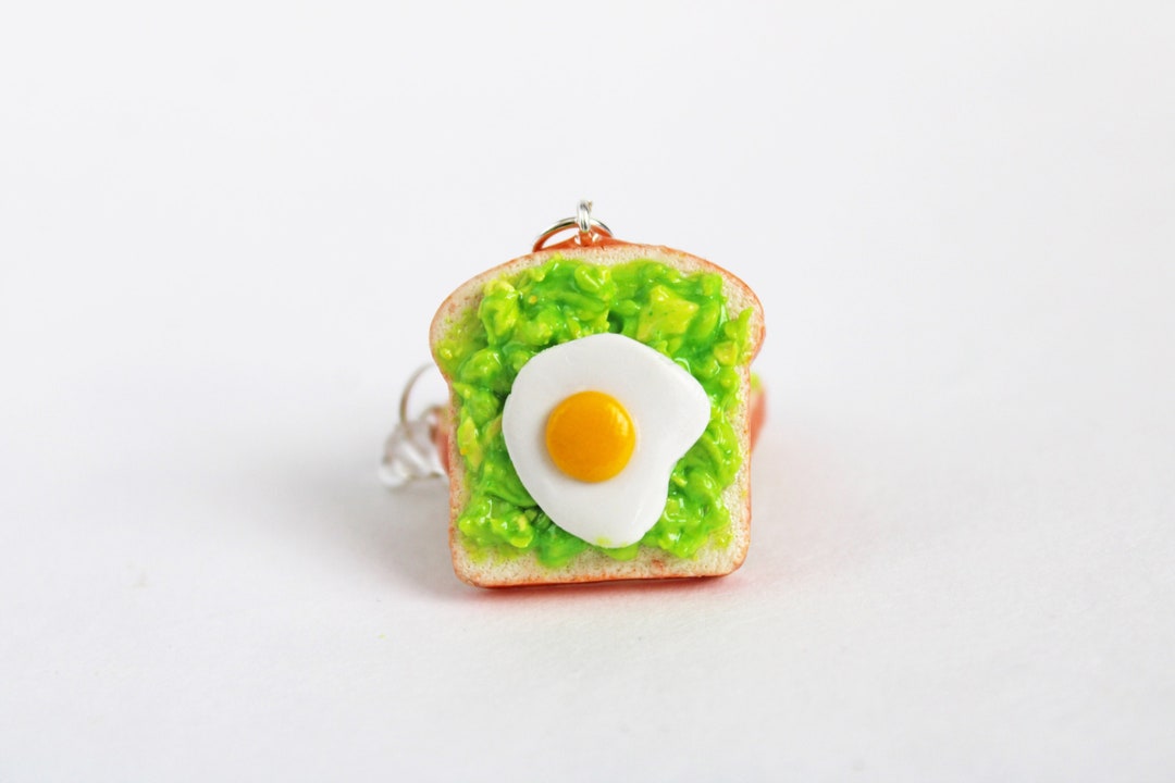 gold-tiny-egg-studs-2_1_grande
