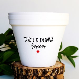 May include: White ceramic planter with the text "TODD & DONNA forever" and a small red heart.