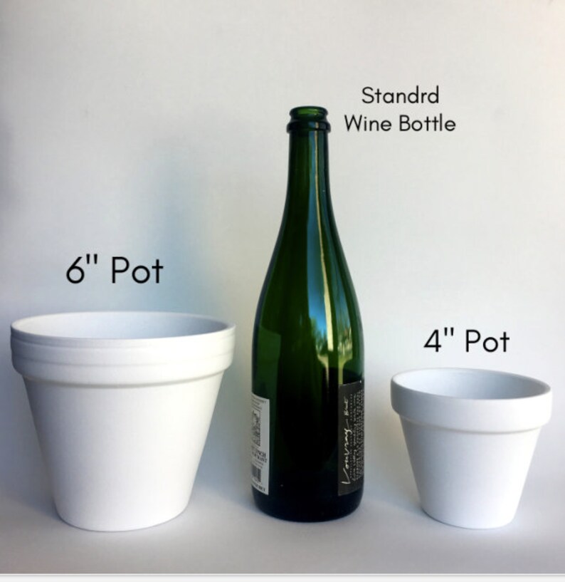 May include: Three white ceramic pots of different sizes, a 4 inch pot, a 6 inch pot, and a standard wine bottle.