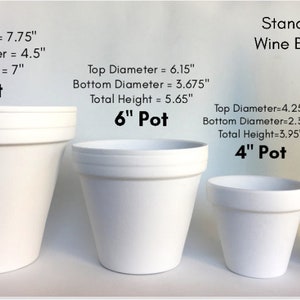 May include: Three white plastic pots, 8 inches, 6 inches, and 4 inches in diameter, next to a standard wine bottle. The pots are labeled with their dimensions in inches.  The wine bottle is green glass.