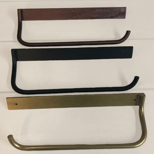 Metal paper towel holder in a variety of finishes