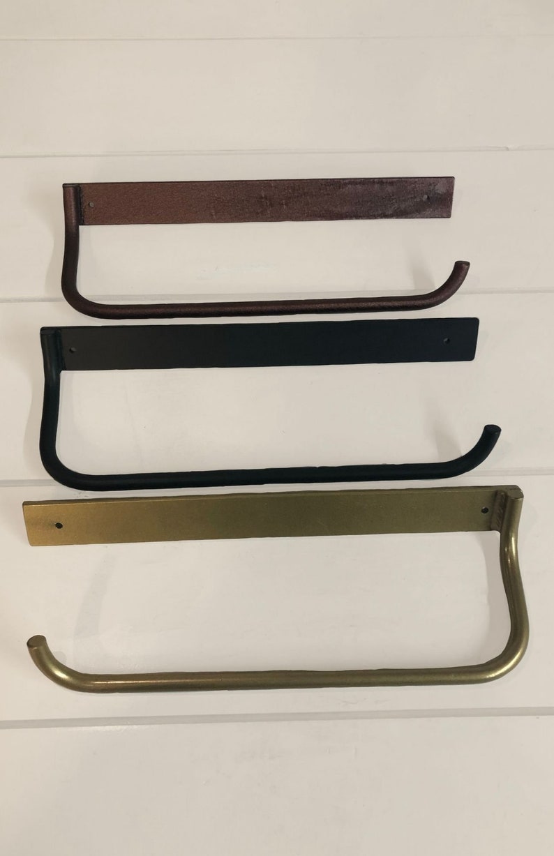 Metal paper towel holder in a variety of finishes