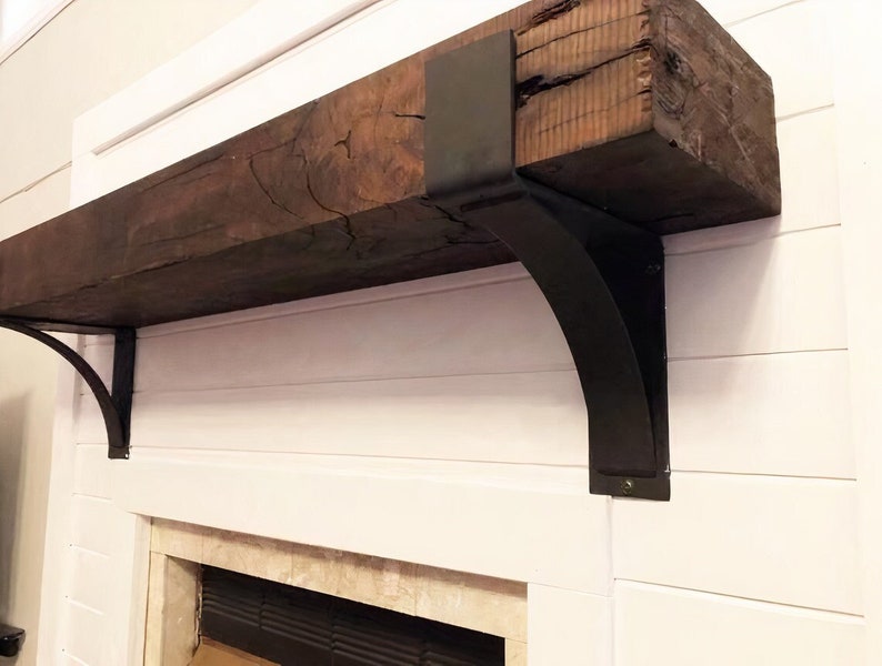 Steel fireplace mantel bracket with 4-inch lip supporting a rustic wood mantel in farmhouse living room decor.