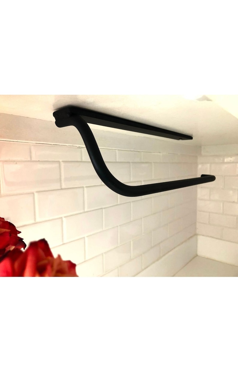 Wall mounted metal paper towel holder