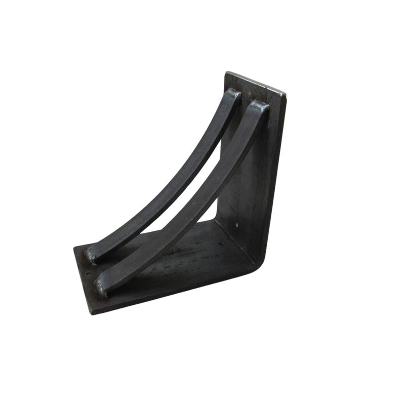 May include: Black metal shelf bracket with two curved supports. The bracket is angled and has a rectangular base.