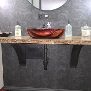 Bathroom vanity support brackets. 4 inch wide brackets with a 4 inch wide curved support bar. Perfect for heavy duty projects