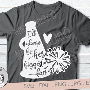 May include: Dark gray t-shirt with a white graphic of a megaphone, heart, and pom-pom. Text on the shirt reads "I'll always be her biggest fan." The design includes the text "SVG. DXF. PNG. JPG. EPS."