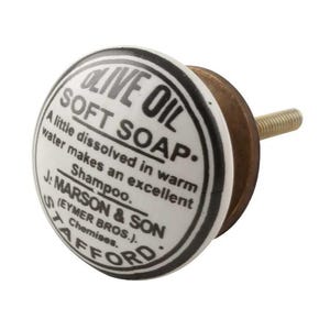 May include: White ceramic knob with a black border and the text "Olive Oil Soft Soap. A little dissolved in warm water makes an excellent Shampoo. J: Marson & Son (Eymer Bros.). Chemises. Stafford."