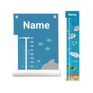 May include: A blue and white growth chart with a dolphin, fish, and bubbles. The chart has a ruler with measurements in feet and inches. The chart is personalized with the name "Name".