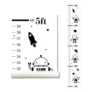 May include: Black and white growth chart featuring a rocket, stars, and robots. The chart measures up to 60 inches or 5 feet.