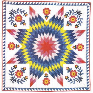 Pode incluir: Um cobertor com uma grande estrela vermelha, branca e azul no centro. A estrela é cercada por uma borda de quadrados amarelos e azuis. O cobertor é decorado com pequenas flores vermelhas nos cantos.