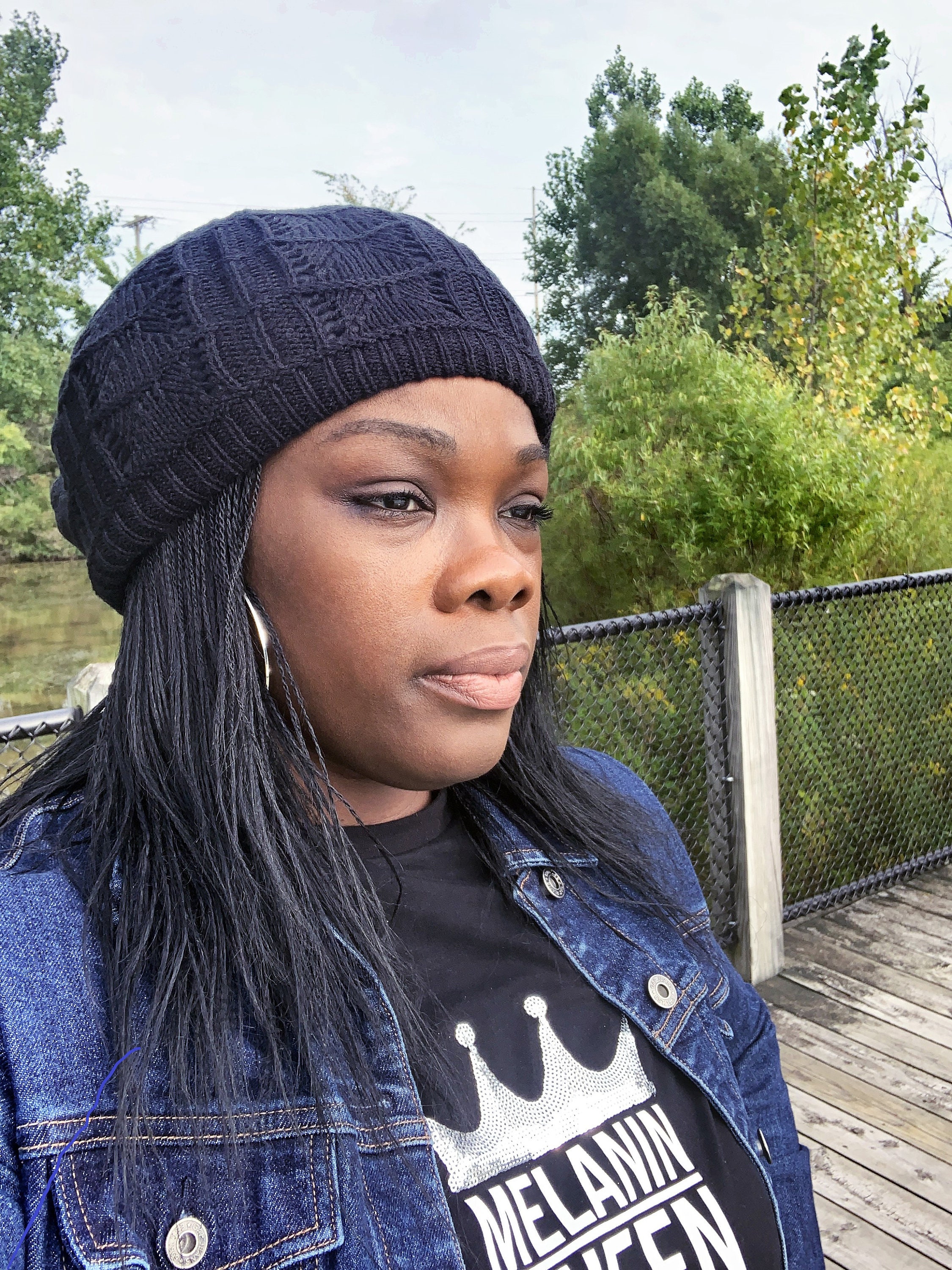 black bobble hat with brown bobble