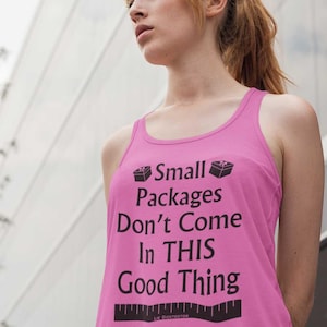 May include: A pink tank top with the text "Small Packages Don't Come In THIS Good Thing" in black. The text is accompanied by small box graphics. The bottom of the tank top has a ruler graphic.