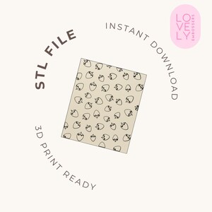 May include: A square beige tile featuring a repeating black line art pattern of strawberries. The text reads STL FILE, INSTANT DOWNLOAD, 3D PRINT READY, and LOVELY EMBOSSERS. This is a digital file for 3D printing with a strawberry motif.