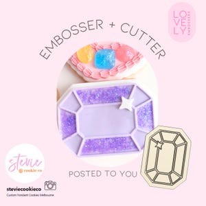 May include: A purple gem-shaped cookie embosser and cutter set. The tool features a faceted design with a small star accent. The text EMBOSSER + CUTTER is visible above the cookie, and the logo for Lovely Embossers and Stevie Cookie Co are present.