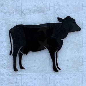 Könnte beinhalten: Schwarze Silhouette einer Kuh, ein einfaches Design, das sich hervorragend für ein Bastelprojekt zum Thema Bauernhof eignet.