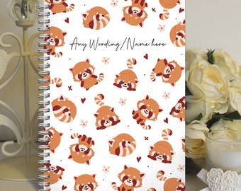 May include: A white spiral bound notebook with a red panda pattern. The notebook has a white background with red pandas in various poses, along with small pink flowers and hearts. The text "Any Wording/Name here" is printed in black on the front cover.