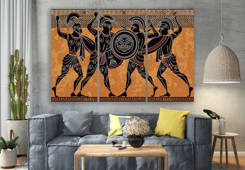 May include: A three-panel canvas print depicting a scene of four ancient Greek warriors in black silhouettes against an orange background. The warriors are holding spears and shields, and the background features a repeating geometric pattern.