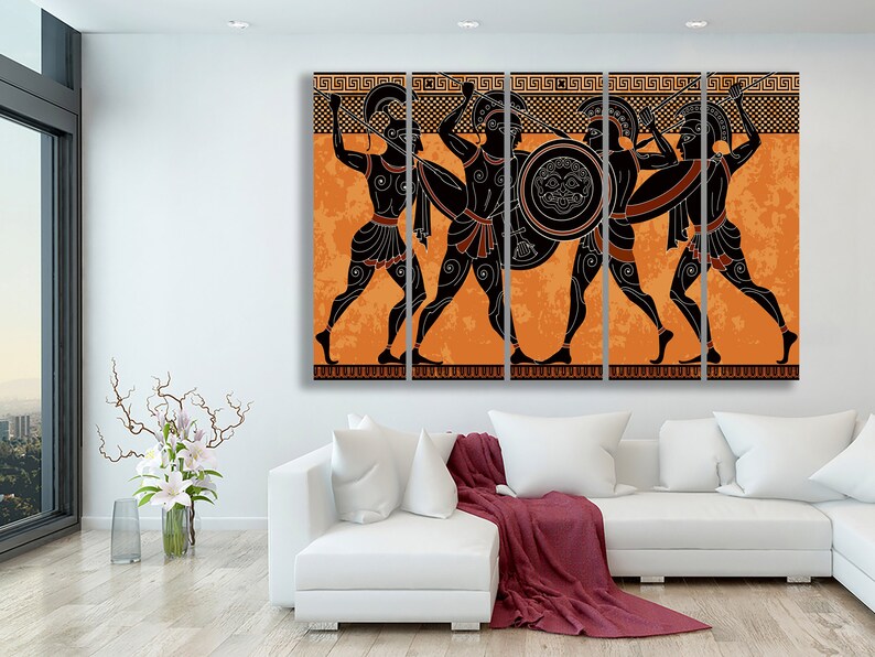 May include: A multi-panel canvas print featuring four ancient Greek warriors in black silhouettes against an orange background. The warriors are holding spears and shields, and their armour is detailed with black lines. The background is a stylised pattern of orange and black.