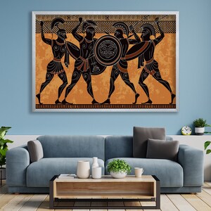May include: A framed print of a black and white illustration of four Greek warriors in battle. The warriors are depicted in a black silhouette against an orange background with a geometric pattern border.