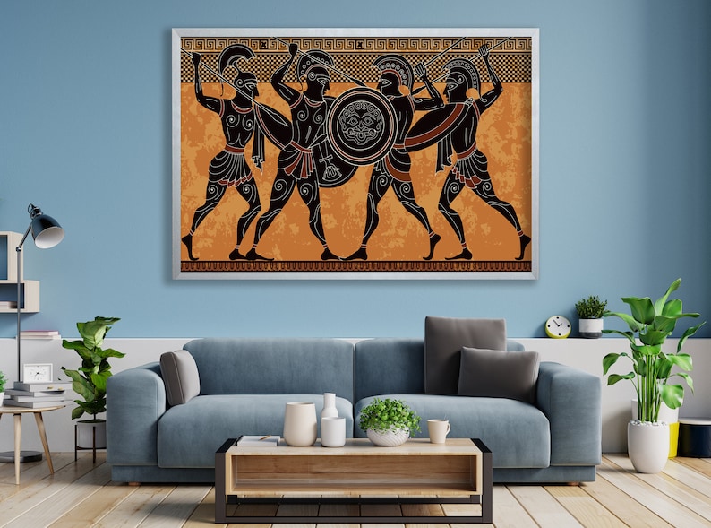 May include: A framed print of a black and white illustration of four Greek warriors in battle. The warriors are depicted in a black silhouette against an orange background with a geometric pattern border.