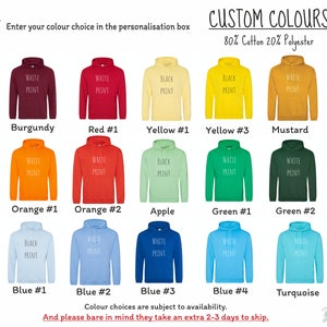 May include: A color chart showing 15 different hoodie colors with white print. The colors include burgundy, red, yellow, mustard, orange, apple green, green, blue, and turquoise. The text "CUSTOM COLORS" and "80% Cotton 20% Polyester" is at the top of the chart.