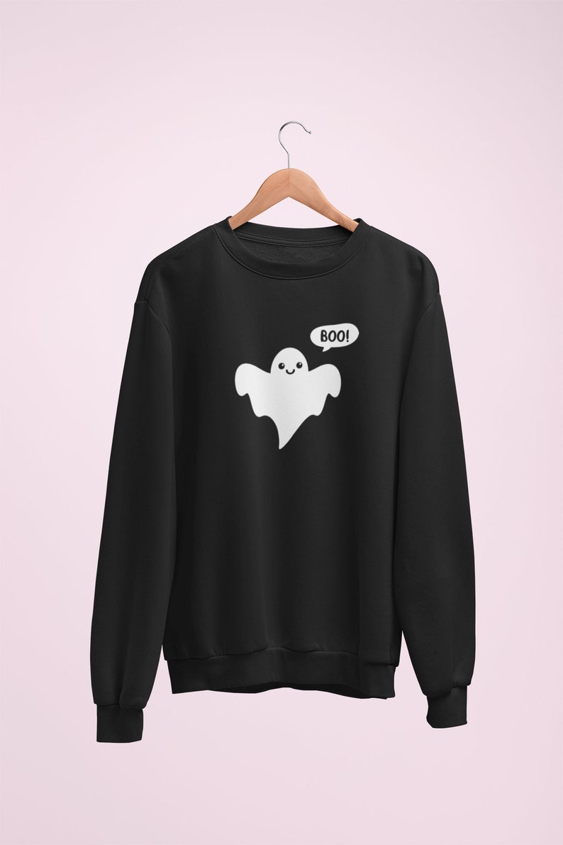 May include: Black sweatshirt with a white ghost graphic and the text "BOO!" in a speech bubble.