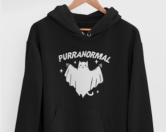 May include: Black hooded sweatshirt with a white graphic of a cat ghost with the text "PURRANORMAL" above it.