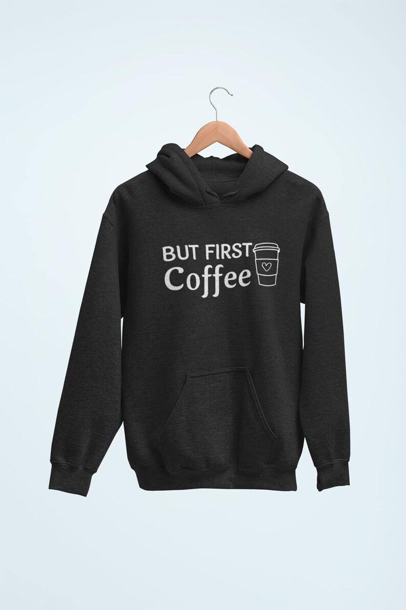 May include: A black hooded sweatshirt with the text "But First Coffee" and a white outline of a coffee cup with a heart on it.