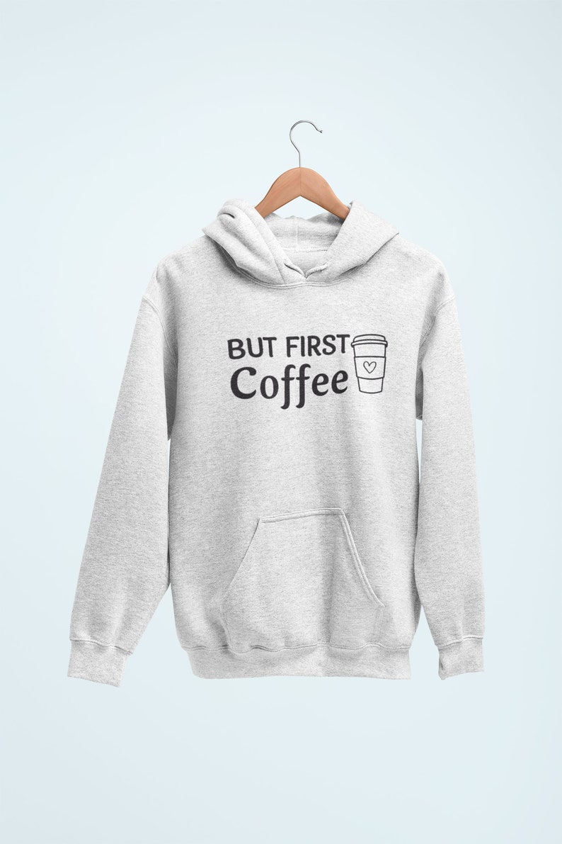 May include: A gray hoodie with a black graphic that says "But First Coffee" and a coffee cup with a heart on it.