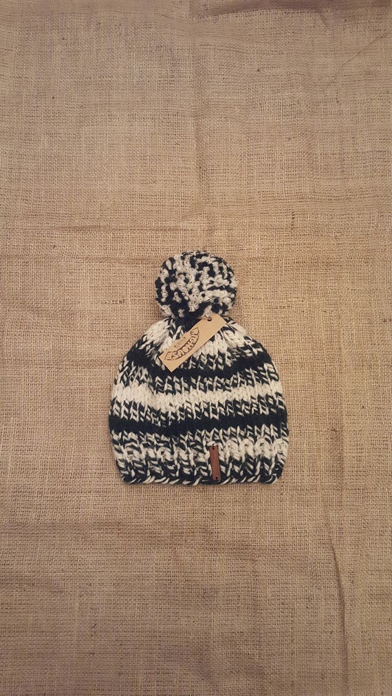 dark green bobble hat