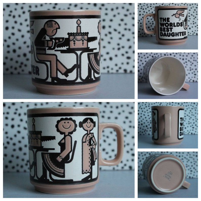 May include: A pink ceramic mug with a black and white illustration of two people and a cake. The text "The World's Best Daughter" is printed on the mug.
