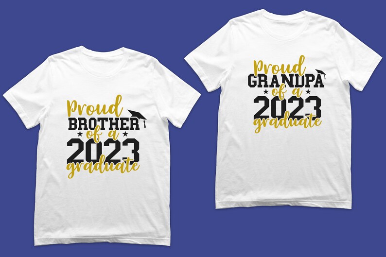 May include: Two white t-shirts with black and gold text. One shirt says "Proud Brother of a 2023 Graduate" and the other says "Proud Grandpa of a 2023 Graduate".