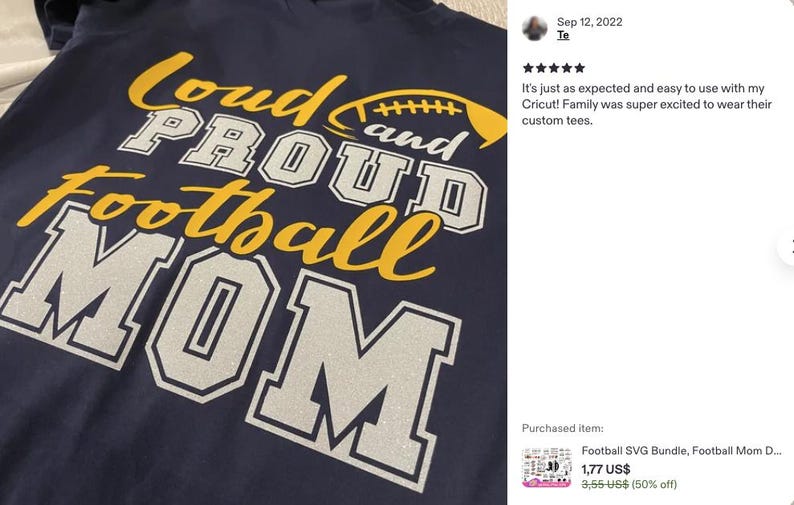 May include: A dark navy blue t-shirt featuring the yellow and silver glitter text "Loud and Proud Football Mom" with a yellow football graphic. The design uses a mix of script and block lettering, with the word "MOM" in large silver block letters.
