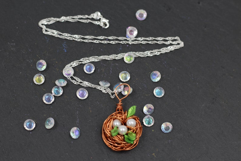 super handmade gift Bird Nest Pendant with 3 beads and green leaves including a 55cm long silver PL necklace