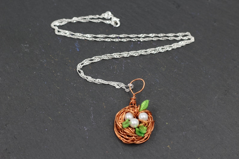 super handmade gift Bird Nest Pendant with 3 beads and green leaves including a 55cm long silver PL necklace