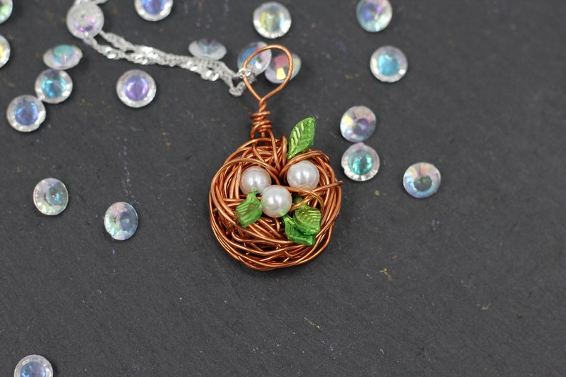 super handmade gift Bird Nest Pendant with 3 beads and green leaves including a 55cm long silver PL necklace