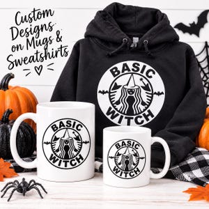 May include: A black hooded sweatshirt and two white ceramic mugs, each featuring a circular black graphic of a witch in a hat with the text BASIC WITCH. The text Custom Designs on Mugs & Sweatshirts is visible in the upper left corner.