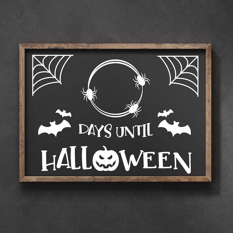 May include: A black chalkboard with a wooden frame displays a Halloween countdown. The chalkboard features white text that reads "Days Until Halloween" with a pumpkin and bats. There are also spiderwebs and spiders on the chalkboard.