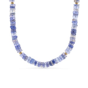 May include: A beaded necklace featuring small, flat, square-cut light blue and periwinkle gemstone beads arranged in a continuous strand, interspersed with small, smooth, round gold-toned metal spacer beads throughout the length of the necklace.
