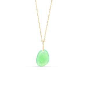 May include: A delicate gold chain necklace featuring a single, smooth, translucent light green pebble-shaped pendant. The pendant is suspended from a simple gold jump ring, creating a minimalist piece of jewelry with a soft, polished finish.