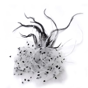 Muslin and feather flower brooch, black and white dot pattern.