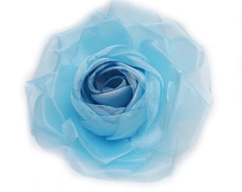 Light blue flower brooch in organza and satin fabric.