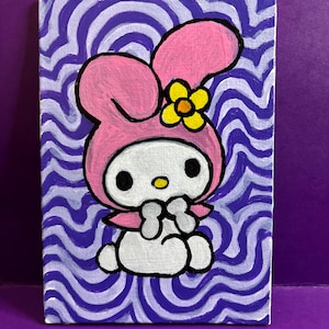 May include: A hand-painted canvas featuring a cartoon character with a pink hood and a yellow flower. The character has a white face and a bow. The background has a wavy purple and white pattern.