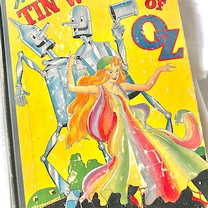 Livro de capa dura &quot;The Tin Woodman of OZ&quot;, de L. Frank Baum, apresentando o design da capa do livro da &quot;Edição Popular&quot; dos anos 1940